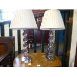 A pair of modern table lamps on square base.