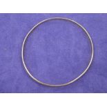 Yellow coloured metal plain bangle, 11.4g