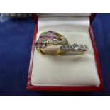 Modern 10K yellow gold dress ring set with pink and white coloured stones, shank stamped 10K size