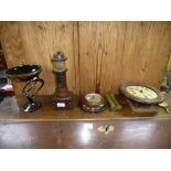 A studio glass bowl, a lighthouse lamp, a barometer and a clock.