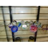 Collection of 13 Caithness glass paperweights all approx 5.5cm high.