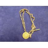 Edwardian 15ct yellow gold watch chain stamped 15, with a South African pond coin attached, dated