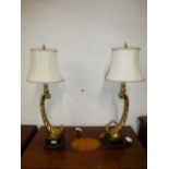 A pair of modern gilt table lamps on square base.