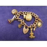 9ct rose gold charm bracelet each link stamped 9ct, hung with various charms including a gourd