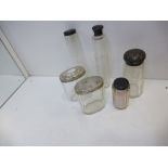 Collection of glass toilet jars with silver lids one A/F together with a glass sugar sifter with