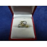 Contemporary 18ct yellow and white gold ring set with a solitaire diamond, approx 0.75ct, shank