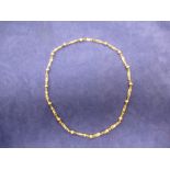 9ct yellow gold necklace with reeded ball spacers, stamped 375, 22cm long, 13g