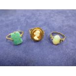 Two 9ct rose gold rings, one set with green coloured stone, gross 6.7g, and an opal ring on a