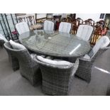 MODA furnishings; a large oval grey wicker style garden table with a set of eight armchairs and