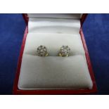 Pair of diamond ear studs set in 9ct white gold, yellow gold stems, item weight 1.6g