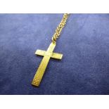 Yellow coloured metal neckchain, unmarked, and a 9ct yellow gold cross pendant, stamped 9ct, total