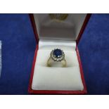 Sapphire and diamond cluster ring on a 14k yellow gold shank, stamped 14k, size K, gross weight 4g