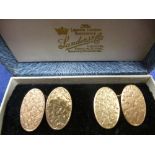 Pair of 15ct yellow gold oval cufflinks, engraved flower decoration, stamped 15, 8.2g, boxed