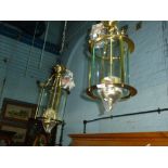 A pair of as new brass and glass ceiling lights