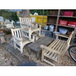 A Chunky teak garden set consisting of a bench, 3 chairs and a table