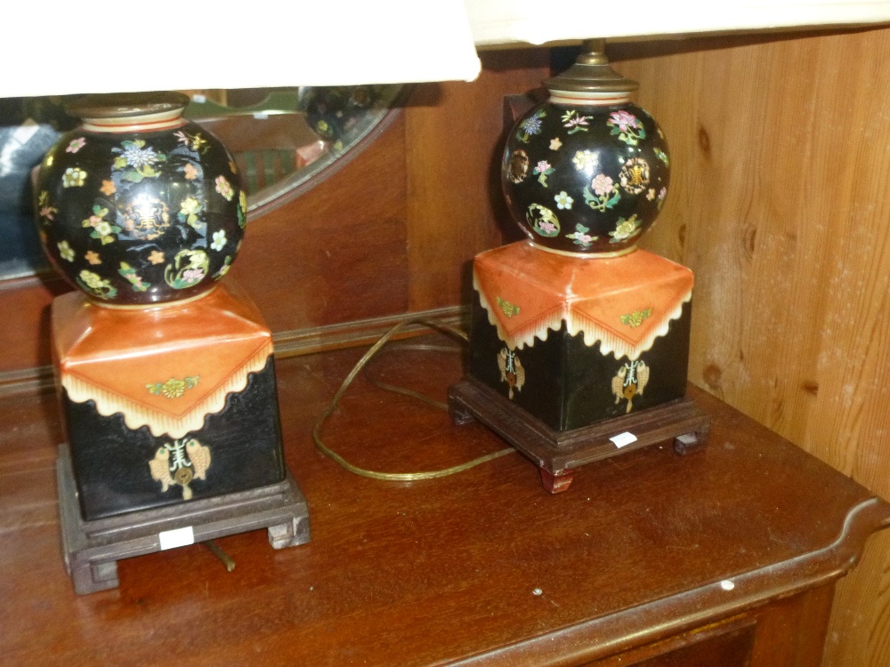 A pair of symmetrical style Japanese lamps