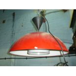 A large Ikea red ceiling light
