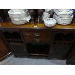 Unusual carved mahogany dresser with raised glazed doors supported by turned columns above drawers