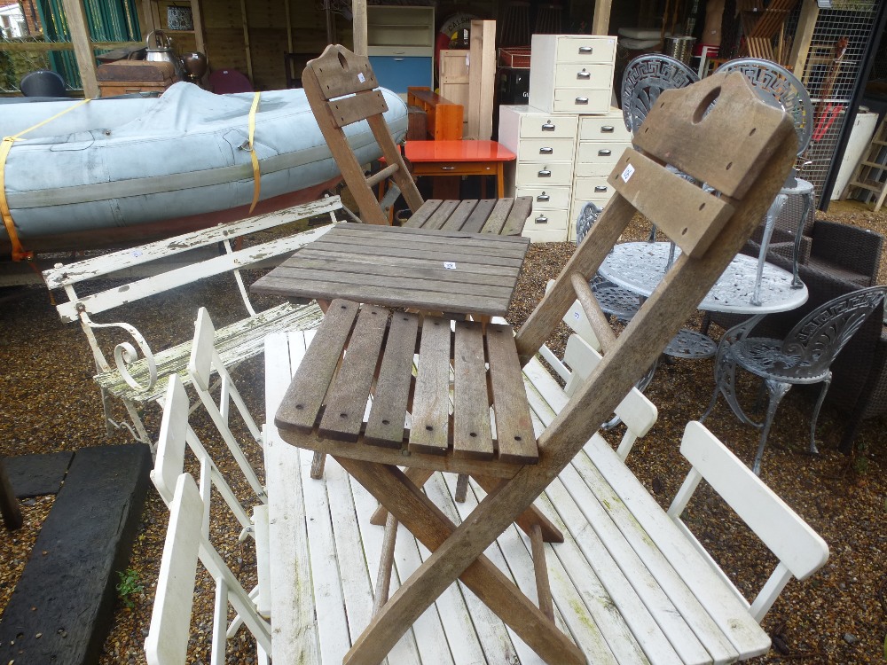 Two folding garden chairs with matching table