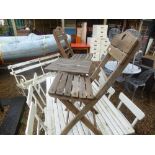 Two folding garden chairs with matching table