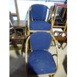 Pair of bamboo framed blue seat and back armchairs and larger example