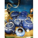 A box of Blue Denby ware to include casserole dishes, tea pots and egg cups