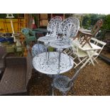 A round metal silver sprayed garden table with rose decoration, with 4 similar chairs