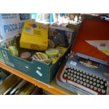 Shelf of mixed items including 'Practical Household' magazines, leatherbound books, easel,