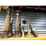 Two pairs of tall wooden candlesticks with three metal lights, etc