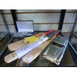 Signed minature cricket bats by Graeme Hick, vintage scouts whistle, and two Police whistle