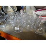 A quantity of glass bowls in two sizes