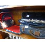 Cased Yamaha orchestral flute, cased Clarinet, and 2 way stereo headphones