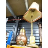 A tall brass table lamp along with a lidded brass and copper pear shaped pot having three claw