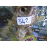 A Poole pottery owl with a Newport pottery jug marked Clarice Cliff and a plate by Staffordshire