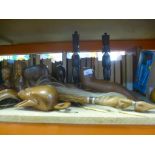 A small selection of carved treen to include tribal figures, animals, etc