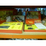 Triang R3E boxed trainset and a Triang Polly trainset and other carriages, etc