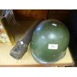 A vintage military helmet and a vintage telescope marked OS822GA No. 41 MkII, 1943