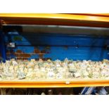 A shelf of Lilliput Lane cottages and buildings to include Holy Island hideaway, Moss ten Manor,