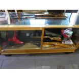 A glass top and fronted oak display cabinet