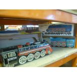 Large scale 60's International express tin lomotive and a similar loco