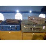 Two vintage suitcases and a leather satchel