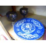 Two blue and white plates and a pair of oriental metal tureens with lids