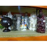 A variety of ornaments to include china figures, a wooden oriental man, decorative clock, etc
