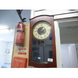 A Seiko quartz wall clock in mahogany case