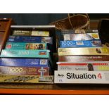 Quantity of jigsaw puzzles, wicker, pictures, etc