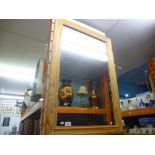 A large pine framed mirror