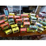 A quantity of boxed die cast tractors and similar by Britains, Siku and others