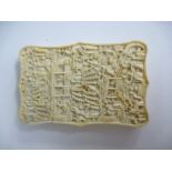 Chinese ivory card case with allover decoration of figures and buildings