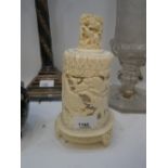 An old carved ivory tusk having decoration of lions and elephants