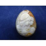 Large shell cameo brooch in metal frame, with safety chain
